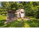 A detached garage and fenced area for animals in the backyard at 73 Richmond Dr, Archer Lodge, NC 27527