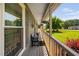 Comfortable porch area featuring a bench, decorative items, and a view of the green lawn at 73 Richmond Dr, Archer Lodge, NC 27527