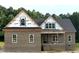 Charming brick home featuring a covered porch and classic design, showcasing quality craftsmanship at 7351 Twin Pines Rd, Spring Hope, NC 27882