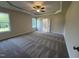 Spacious bedroom with trey ceilings, carpeting, and a ceiling fan at 78 Mineral Springs Way, Benson, NC 27504