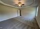 Spacious bedroom featuring neutral walls, plush carpeting, crown molding, and a modern ceiling fan at 78 Mineral Springs Way, Benson, NC 27504