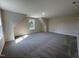 Spacious bonus room with plush carpeting, dormer windows, and neutral walls at 78 Mineral Springs Way, Benson, NC 27504
