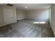 Bonus room with plush carpeting, neutral walls, large windows, and a closet at 78 Mineral Springs Way, Benson, NC 27504
