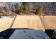 An aerial view highlighting the backyard and property lines, featuring a fenced yard at 78 N Porcenna Ln, Clayton, NC 27527