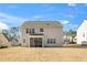 Beautiful back exterior view of a home with neutral siding and a cozy, screened porch at 78 N Porcenna Ln, Clayton, NC 27527