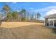 Large backyard with an enclosed porch, perfect for outdoor entertaining and relaxation at 78 N Porcenna Ln, Clayton, NC 27527