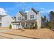 Charming two-story home with a two-car garage and well-maintained lawn at 78 N Porcenna Ln, Clayton, NC 27527