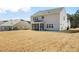 Spacious home featuring a well-maintained lawn and rear exterior with a screened-in porch at 78 N Porcenna Ln, Clayton, NC 27527