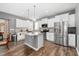 Bright kitchen features stainless steel appliances, granite countertops, and white cabinetry at 78 N Porcenna Ln, Clayton, NC 27527