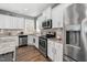 Well-lit kitchen features stainless steel appliances and granite countertops at 78 N Porcenna Ln, Clayton, NC 27527