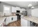 Open kitchen with stainless steel appliances, granite countertops, and ample cabinet space at 78 N Porcenna Ln, Clayton, NC 27527