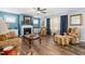 Inviting living room with a cozy fireplace and plush seating, perfect for relaxation at 78 N Porcenna Ln, Clayton, NC 27527