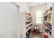 Walk-in pantry boasts ample storage space with shelving and a window for natural light at 78 N Porcenna Ln, Clayton, NC 27527