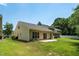 Spacious backyard with a well-maintained lawn, and patio space at 7807 Braefield Dr, Raleigh, NC 27616