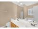 Ensuite bathroom boasts dual sinks, shower, and bathtub for ultimate convenience at 7807 Braefield Dr, Raleigh, NC 27616