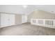 Spacious bedroom features neutral walls, carpet and ceiling fan with ample closet space at 7807 Braefield Dr, Raleigh, NC 27616