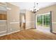 This dining area offers a sliding glass door to the patio and backyard at 7807 Braefield Dr, Raleigh, NC 27616