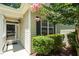 Close up of the front entrance including black shutters and flower tree at 7807 Braefield Dr, Raleigh, NC 27616