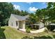 Well-maintained home with manicured lawn, mature landscaping and view of covered front entrance at 7807 Braefield Dr, Raleigh, NC 27616