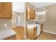 The kitchen is open to the living room and dining room, offering nice flow and hardwood floors at 7807 Braefield Dr, Raleigh, NC 27616