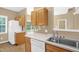 This kitchen features matching appliances, countertops, and light wood cabinets for storage at 7807 Braefield Dr, Raleigh, NC 27616