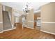 Open floor plan showcases hardwood floors and ample natural light from nearby kitchen and foyer at 7807 Braefield Dr, Raleigh, NC 27616