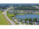 Scenic community by a tranquil lake, featuring a pool, clubhouse, and easy access to a nearby highway at 8007 Crookneck Dr, Angier, NC 27501