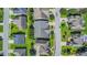 Aerial view of a quiet, tree-lined neighborhood with green lawns and well-spaced homes at 8007 Crookneck Dr, Angier, NC 27501
