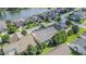 Scenic aerial view of a beautiful lakeside neighborhood with manicured lawns and tree-lined streets at 8007 Crookneck Dr, Angier, NC 27501
