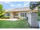 Backyard with green lawn, trimmed hedges, small patio and storage building, great for outdoor activities at 8007 Crookneck Dr, Angier, NC 27501