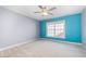 Bedroom featuring a ceiling fan, large window, and neutral carpeting at 8007 Crookneck Dr, Angier, NC 27501
