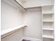 Walk-in closet with built-in shelving, rods, and ample storage space at 8007 Crookneck Dr, Angier, NC 27501