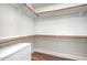 Walk-in closet featuring built-in shelving and drawers for organized storage at 8007 Crookneck Dr, Angier, NC 27501