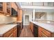 Kitchen features stainless steel appliances, hardwood floors and quartz countertops at 8007 Crookneck Dr, Angier, NC 27501