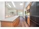 Kitchen features stainless steel appliances, hardwood floors and skylight at 8007 Crookneck Dr, Angier, NC 27501