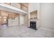 Spacious living room featuring a fireplace, staircase and upper-level balcony at 8007 Crookneck Dr, Angier, NC 27501