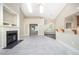 Bright living room with fireplace, french doors, and bar seating at 8007 Crookneck Dr, Angier, NC 27501
