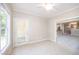 Neutral room showing tile flooring, access door to exterior, and pocket door to another area at 8007 Crookneck Dr, Angier, NC 27501