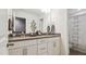 Bright bathroom featuring dual sinks, modern fixtures, and a shower with a curtain at 817 James J Freeland Memorial Dr, Hillsborough, NC 27278