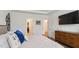 This spacious bedroom boasts an ensuite bathroom, walk-in closet, and modern media console at 817 James J Freeland Memorial Dr, Hillsborough, NC 27278