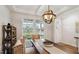 Cozy dining area featuring a modern light fixture and a view of the front yard at 817 James J Freeland Memorial Dr, Hillsborough, NC 27278