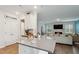 Spacious kitchen island with seating, open to the living room with fireplace at 817 James J Freeland Memorial Dr, Hillsborough, NC 27278