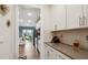 Stylish kitchen with white cabinets, gray countertops, and stainless steel appliances at 817 James J Freeland Memorial Dr, Hillsborough, NC 27278