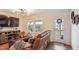 Cozy living room with natural light, plush leather seating, and contemporary decor at 817 James J Freeland Memorial Dr, Hillsborough, NC 27278