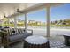 Inviting outdoor living area with seating, fans, and a view of the sparkling community pool at 817 James J Freeland Memorial Dr, Hillsborough, NC 27278