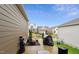 Back patio with an outdoor kitchen, a fire pit, and seating areas for comfortable outside enjoyment at 817 James J Freeland Memorial Dr, Hillsborough, NC 27278