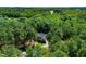 A home nestled within a lush green forest offering privacy and serene natural surroundings at 83 Calabria Ct, Clayton, NC 27527