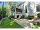 Image of a fenced backyard with a screened porch, patio, and artifical turf at 83 Calabria Ct, Clayton, NC 27527
