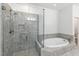 Bathroom with glass shower and tub at 83 Calabria Ct, Clayton, NC 27527