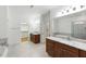 Elegant bathroom featuring dual vanities, granite countertops and soaking tub at 83 Calabria Ct, Clayton, NC 27527